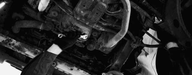 Man Checking Car Undercarriage 